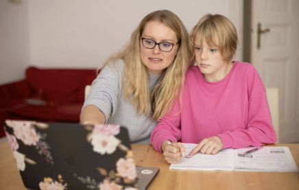 Parent supporting a child while learning at home